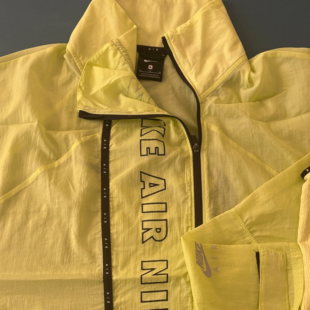 Nike Air Light Yellow Windbreaker, sleeveless shirt.